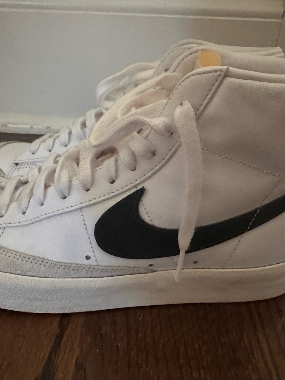 Nike High-Top Sneakers in White with Black Swoosh